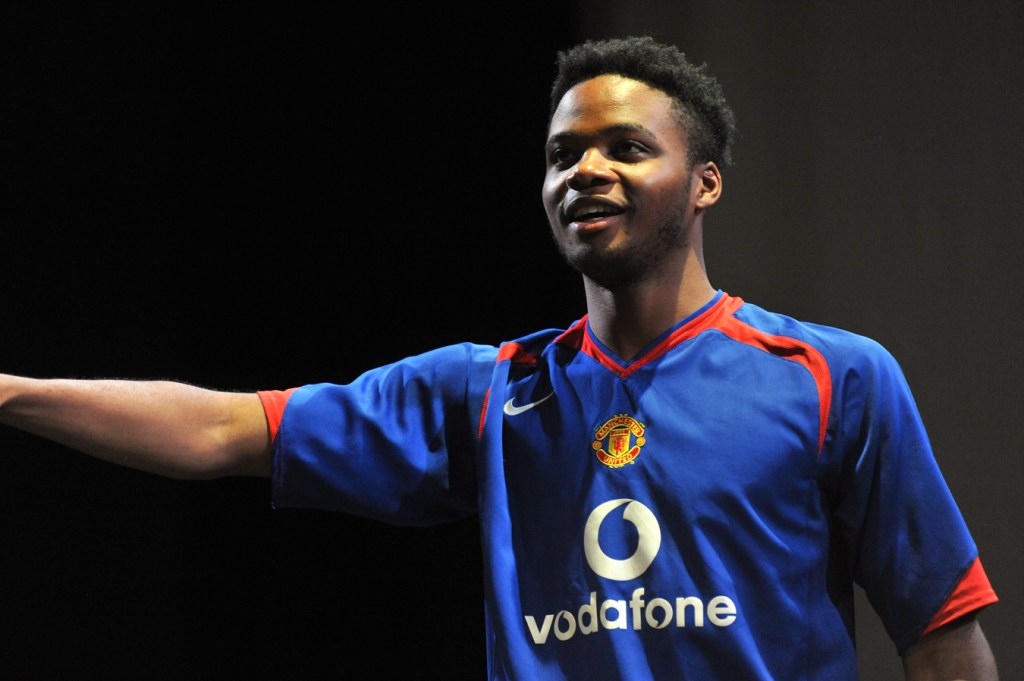 A young man points emphatically